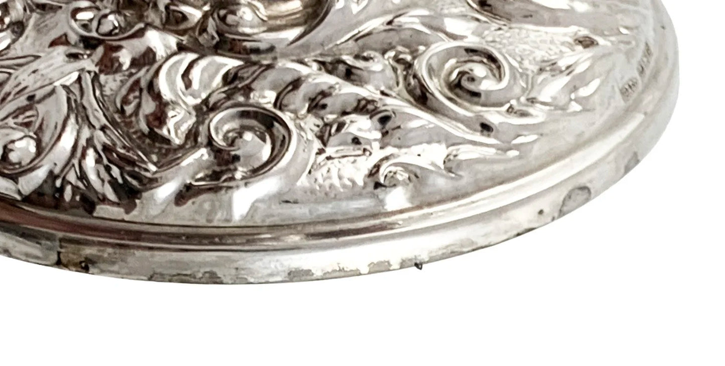 Vintage sterling silver candlestick embossed with flowers in Art Nouveau style