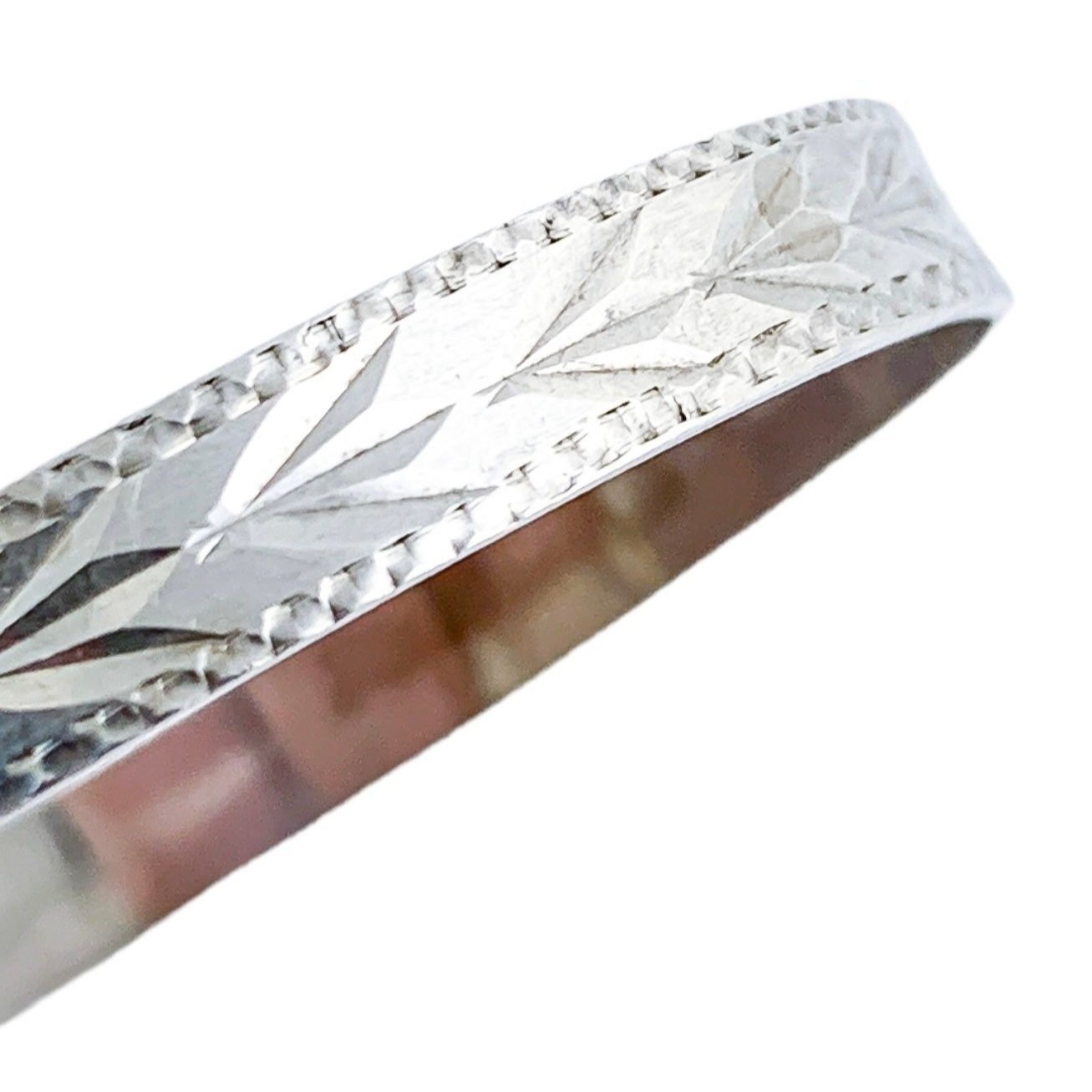 1970’s sterling silver child's adjustable "belt" bracelet with buckle detail and bright-cut leaf design