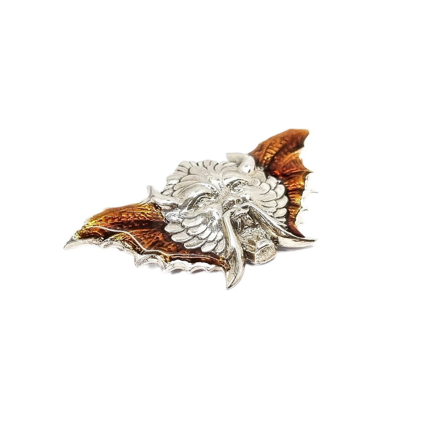 Quirky winged devil face brooch in sterling silver and orange enamel