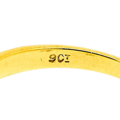 Vintage moissanite solitaire engagement ring set in yellow gold