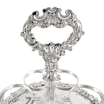 George III Old Sheffield silver plate cruet stand for 7 bottles, raised on paw feet