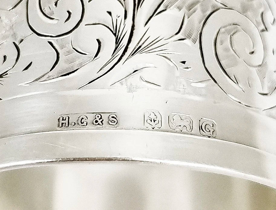 1930's large sterling silver napkin ring engraved with scrolling leaves