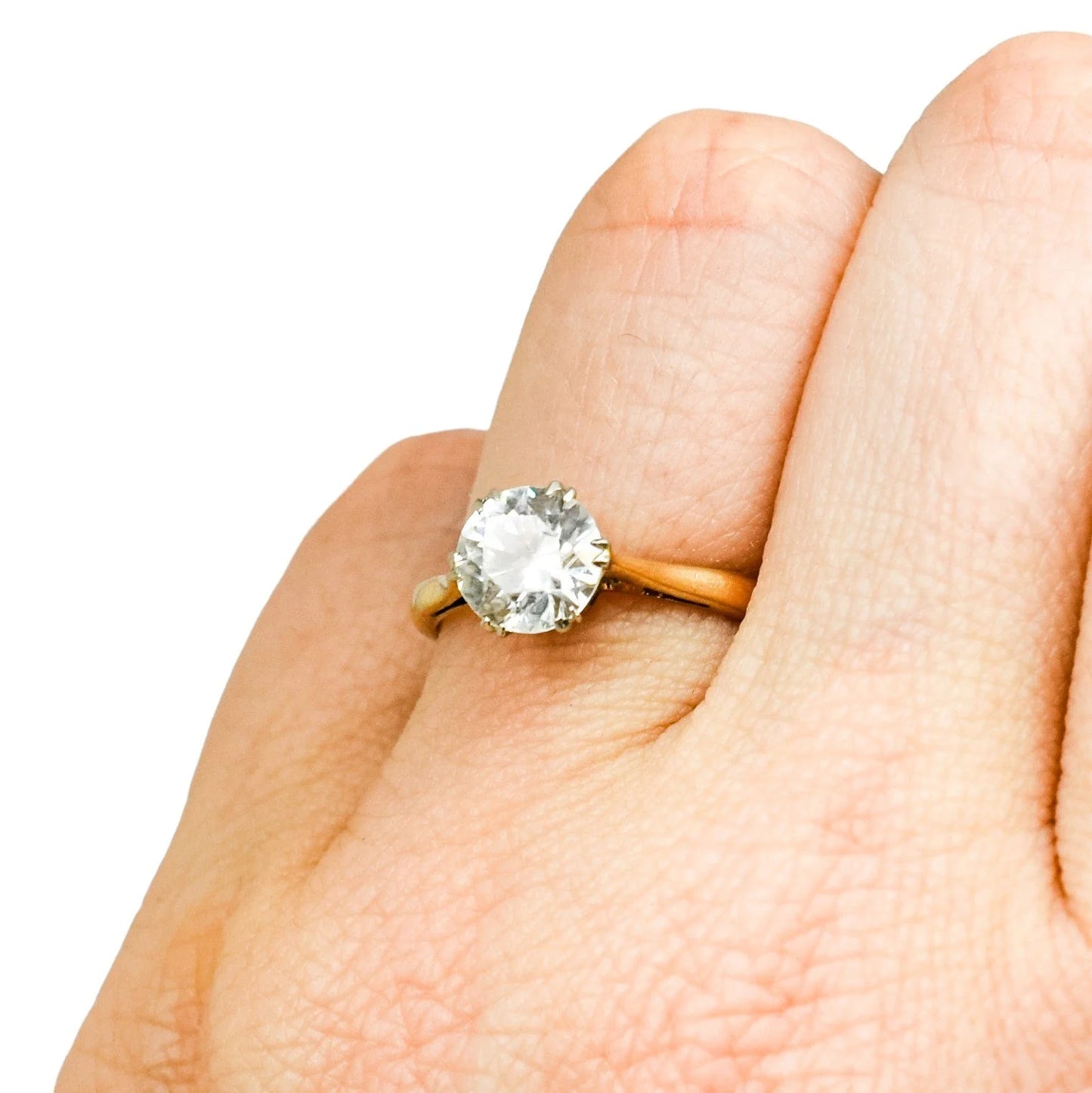 Vintage moissanite solitaire engagement ring set in yellow gold