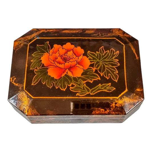 Octagonal lacquerware jewellery box decorated with a red flower