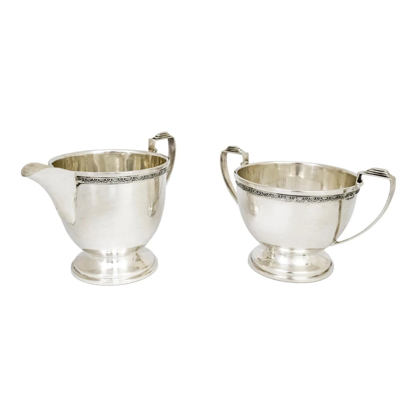 Three piece Art Deco sterling tea set with bow garlands and geometric handles