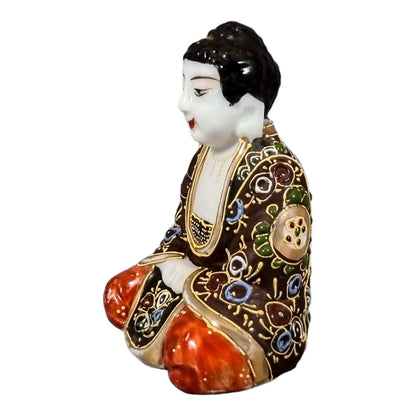 Meiji Japanese Kutani porcelain sitting Buddha figurine, enamel moriage by Dai Nippon Tsukuru