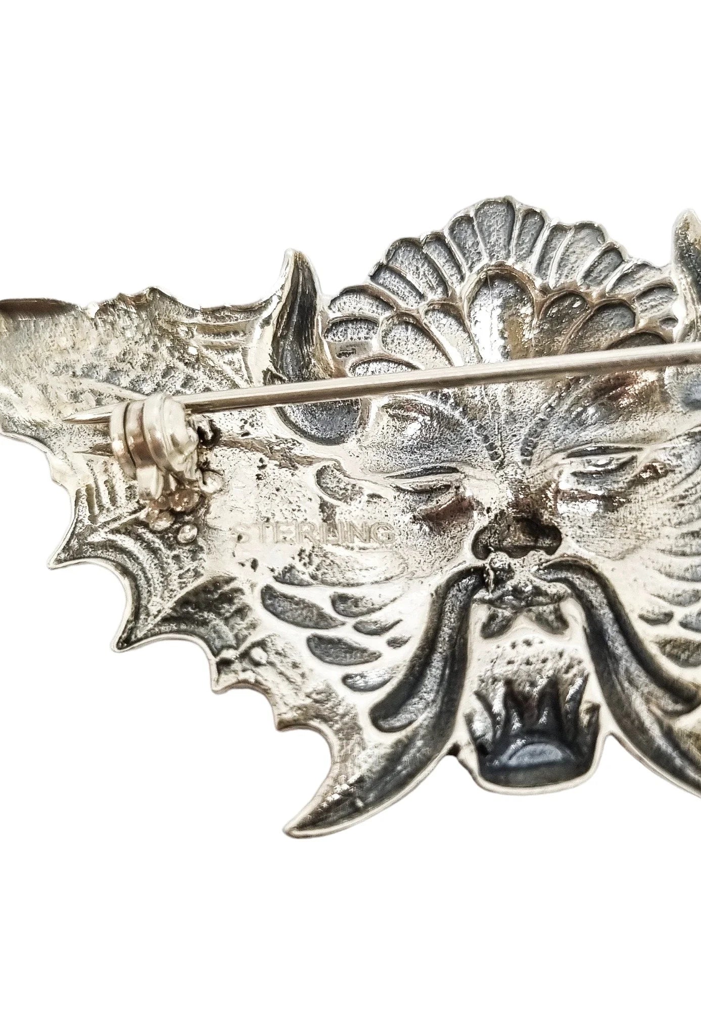 Quirky winged devil face brooch in sterling silver and orange enamel