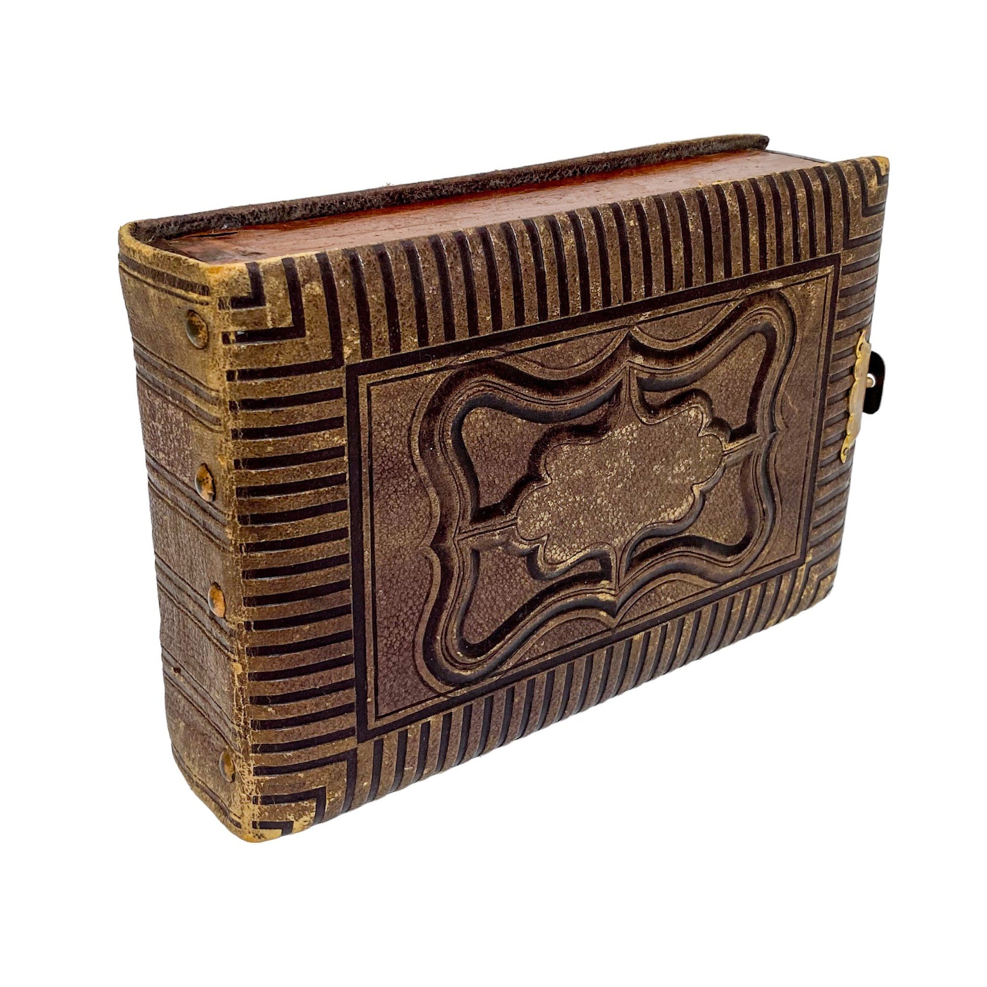 Storage box converted from Victorian tooled leather photo album with brass clasp