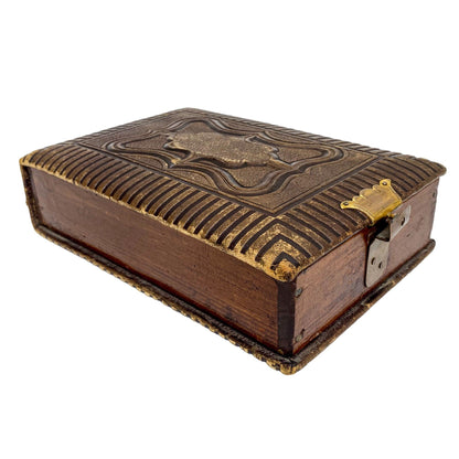 Storage box converted from Victorian tooled leather photo album with brass clasp