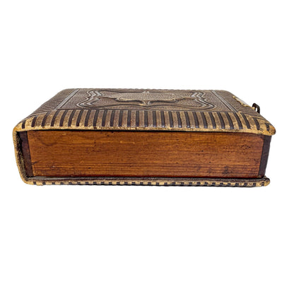 Storage box converted from Victorian tooled leather photo album with brass clasp