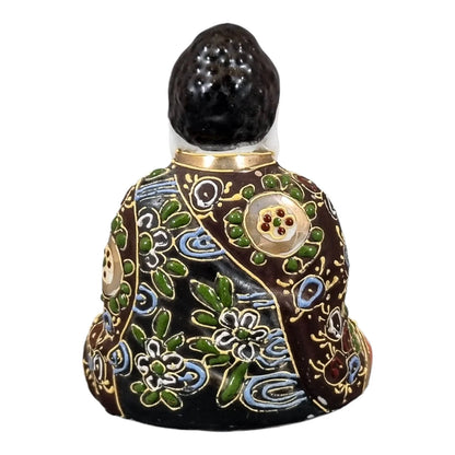 Meiji Japanese Kutani porcelain sitting Buddha figurine, enamel moriage by Dai Nippon Tsukuru
