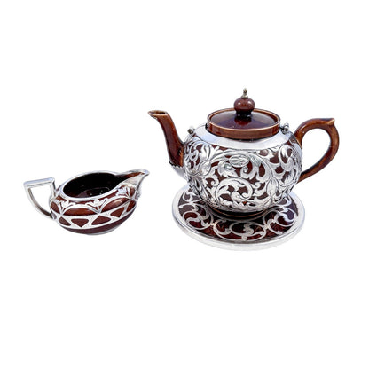 Art Nouveau Lenox brown teapot, stand and creamer with sterling silver overlay