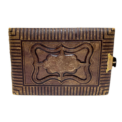 Storage box converted from Victorian tooled leather photo album with brass clasp