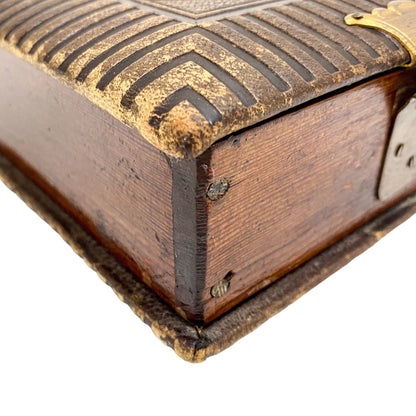 Storage box converted from Victorian tooled leather photo album with brass clasp