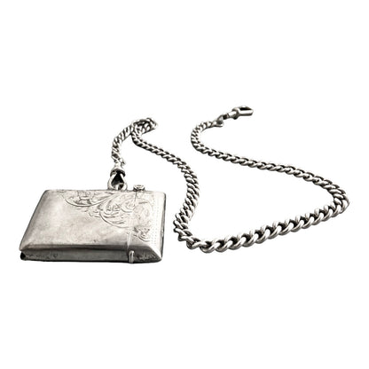 WWI sterling silver vesta case engraved with scrolls, on a Victorian watch curb Albert chain