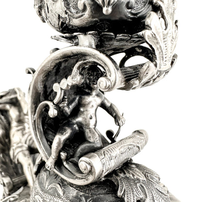 Renaissance Revival Hanau pair of large figural candlesticks with Pan and cherubs