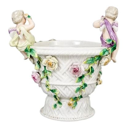 19th century German porcelain basket weave vase with rose garlands and cherubs