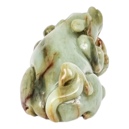 Qing dynasty celadon russet jade carving of lion and bird