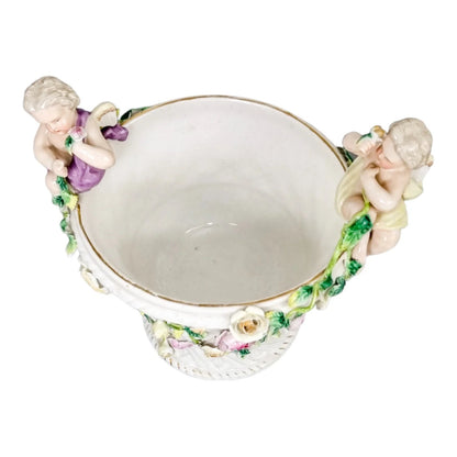 19th century German porcelain basket weave vase with rose garlands and cherubs