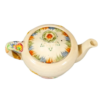 Art Deco bachelor teapot decorated with high-relief flowers and wheat stalks