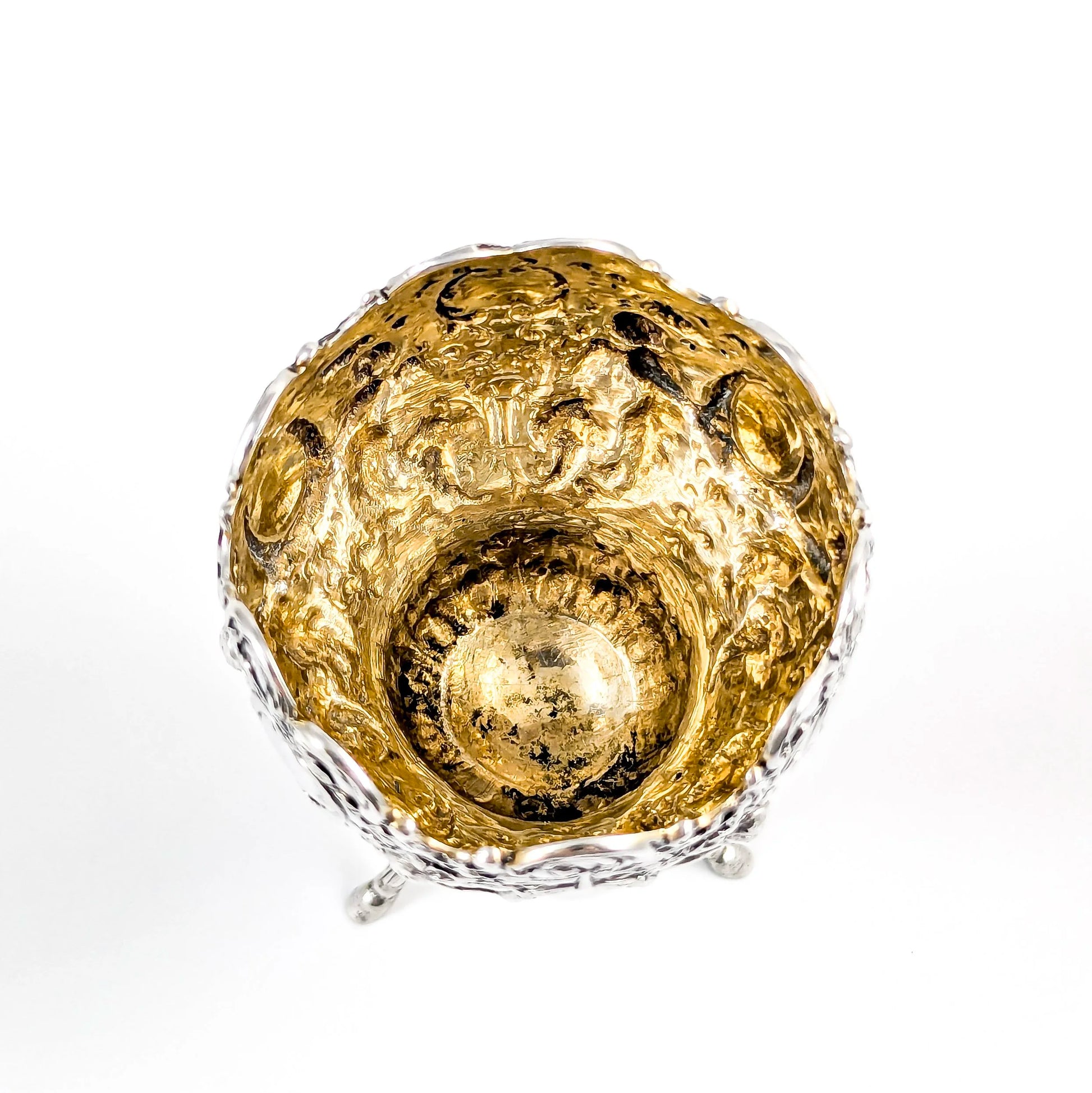 Hanau sterling silver tripod cup with repoussé putti, floral garlands, and ram’s head feet, Baroque Revival, c. 1880s