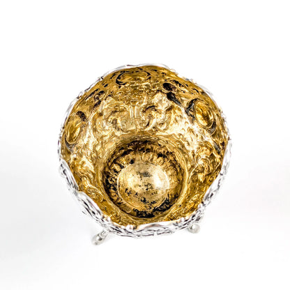 Hanau sterling silver tripod cup with repoussé putti, floral garlands, and ram’s head feet, Baroque Revival, c. 1880s