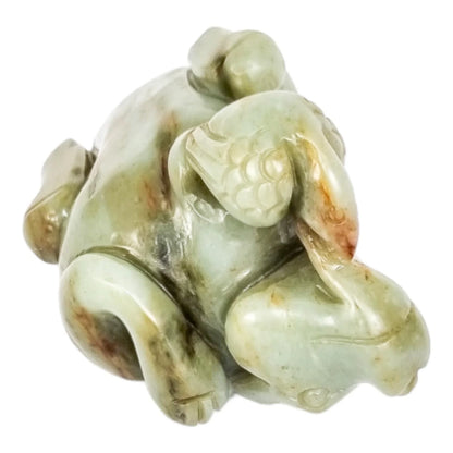 Qing dynasty celadon russet jade carving of lion and bird