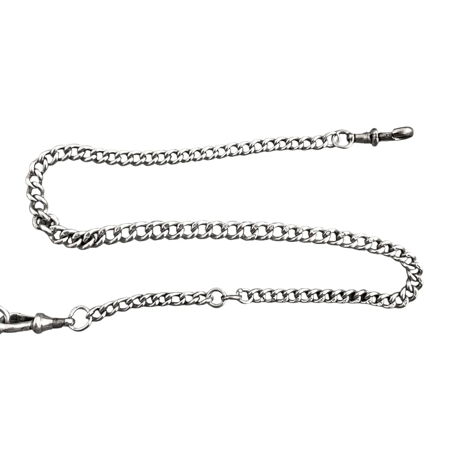 WWI sterling silver vesta case engraved with scrolls, on a Victorian watch curb Albert chain