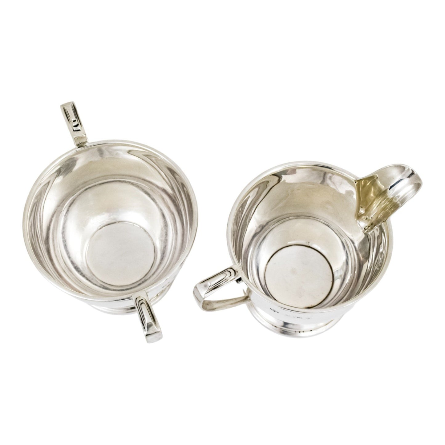 Three piece Art Deco sterling tea set with bow garlands and geometric handles