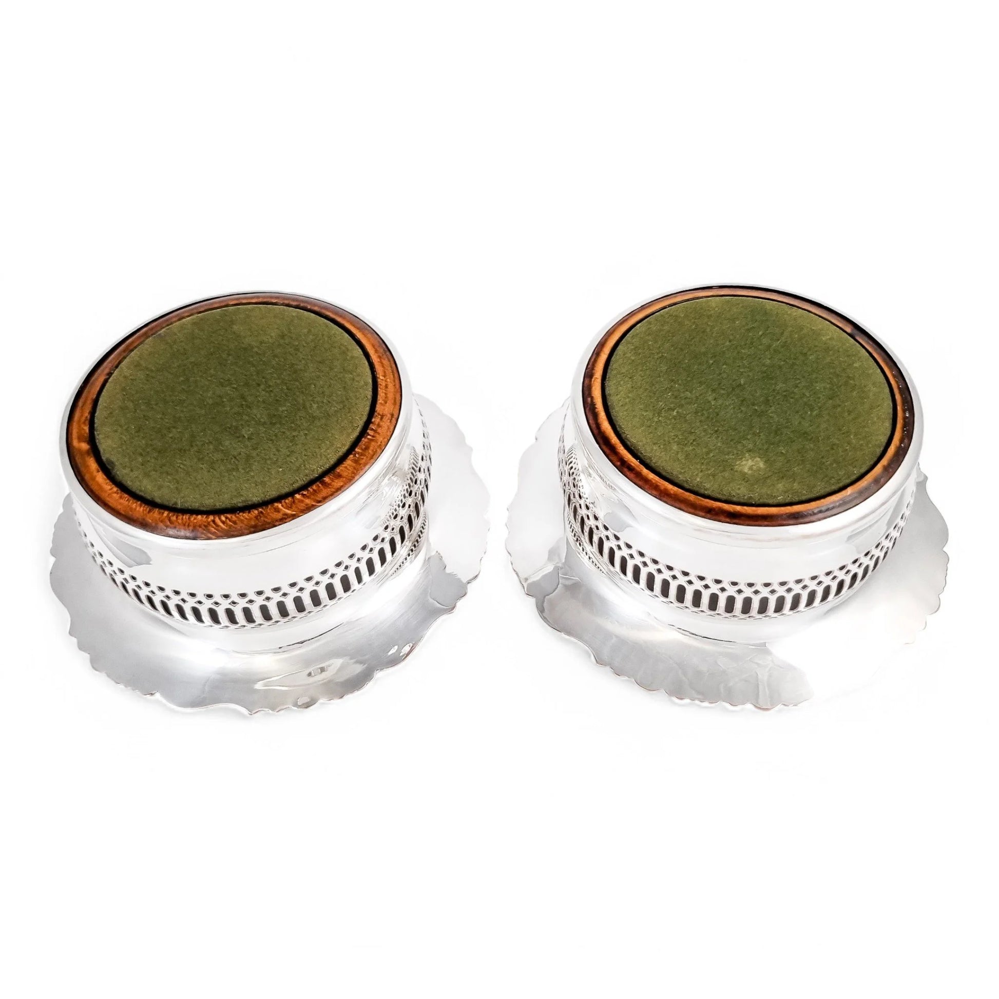 Antique silver plated magnum bottle coasters with Rococo foliate borders and mahogany bases, c. 1880s