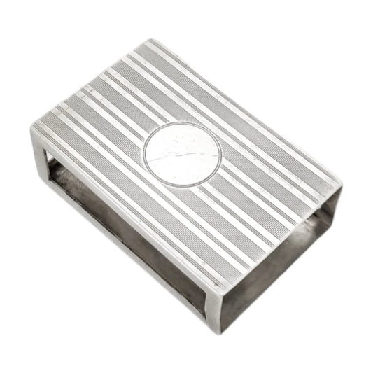 Art Deco sterling silver matchbox holder with vacant cartouche and banded design