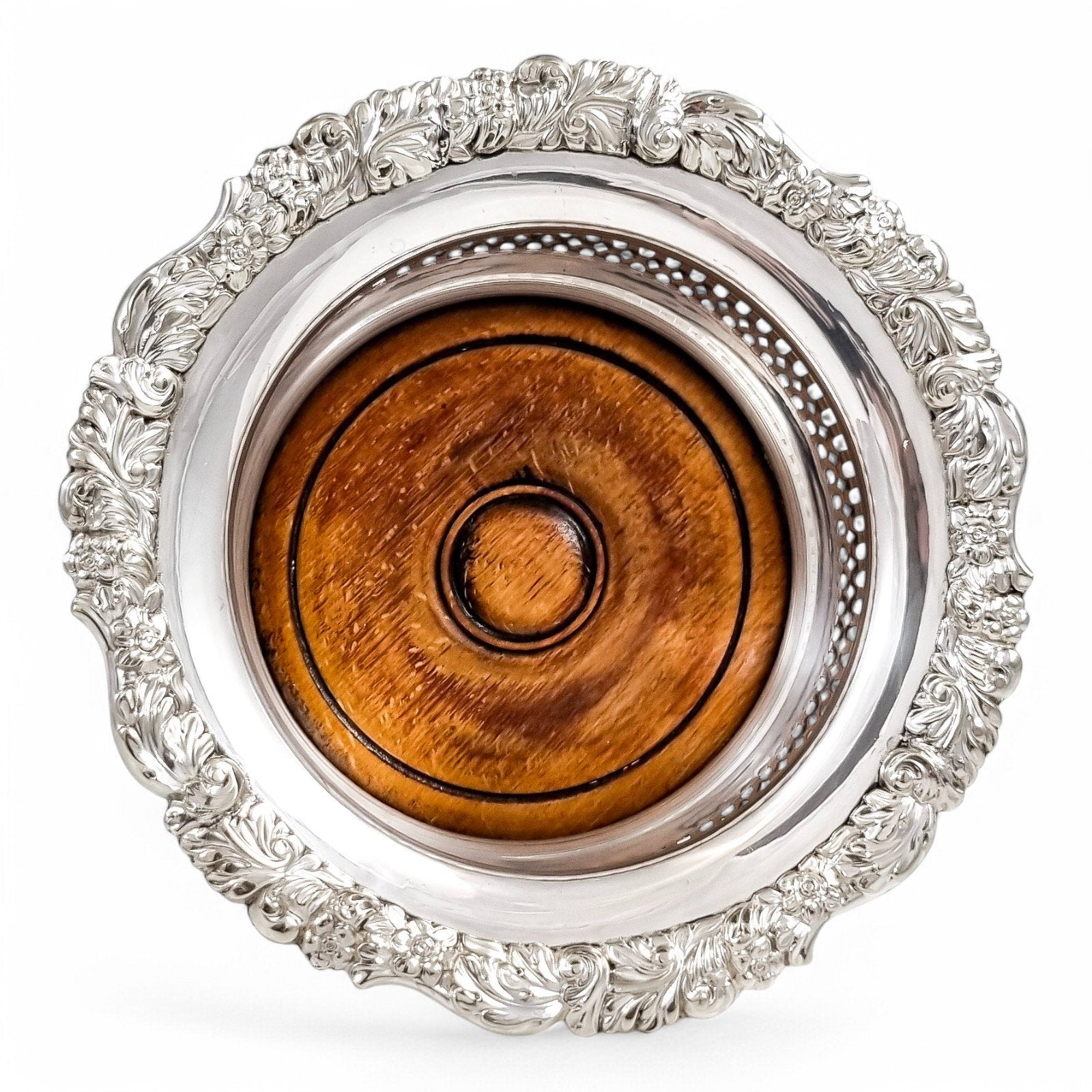 Antique silver plated magnum bottle coasters with Rococo foliate borders and mahogany bases, c. 1880s