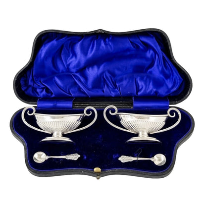 Edwardian set of 2 Neoclassical gilt sterling silver boxed navette salts with spoons