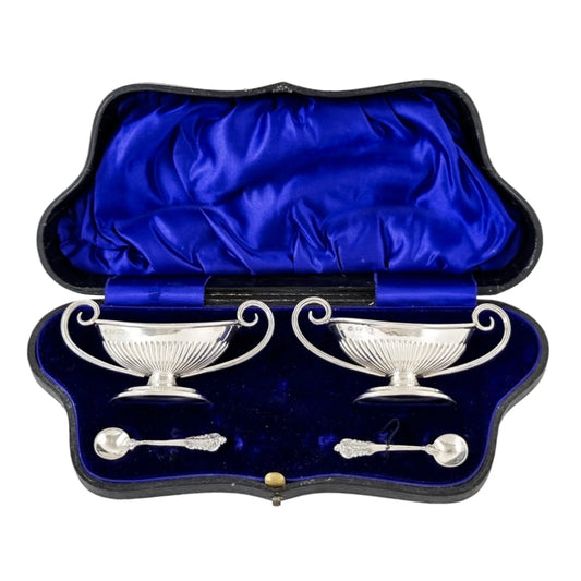 Edwardian set of 2 Neoclassical gilt sterling silver boxed navette salts with spoons