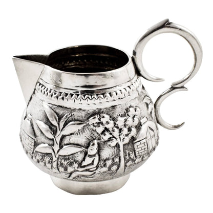 Colonial Raj Calcutta silver milk jug / creamer embossed with village scenes