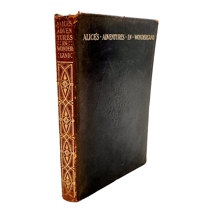 Illustrated leather bound first edition thus of "Alice's Adventures in Wonderland"