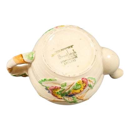 Art Deco bachelor teapot decorated with high-relief flowers and wheat stalks