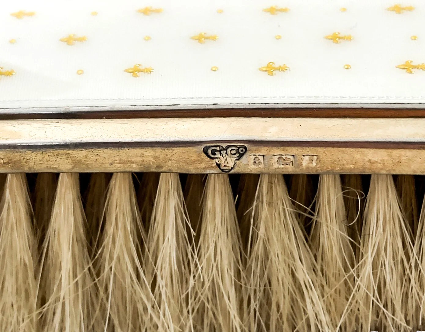 Garrard & Co gilded silver white guilloché enamel clothes brush with gold fleur-de-lis