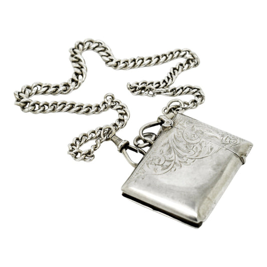 WWI sterling silver vesta case engraved with scrolls, on a Victorian watch curb Albert chain