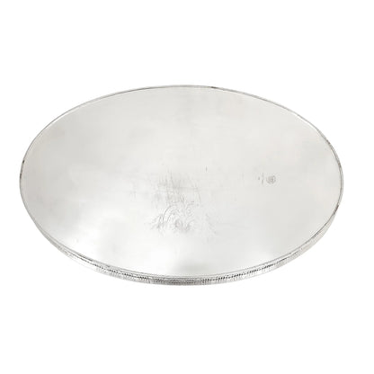 Victorian style mahogany and sterling silver bottle coaster with pierced border