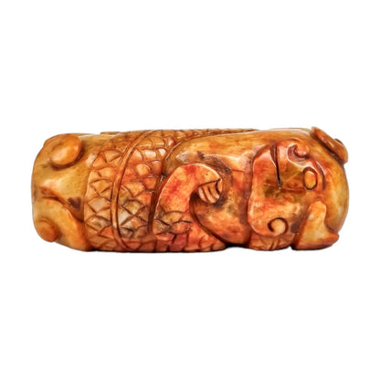 Qing dynasty beige russet jade amulet carving of coiling dragon