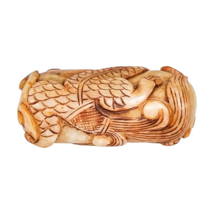 Qing dynasty beige russet jade amulet carving of coiling dragon