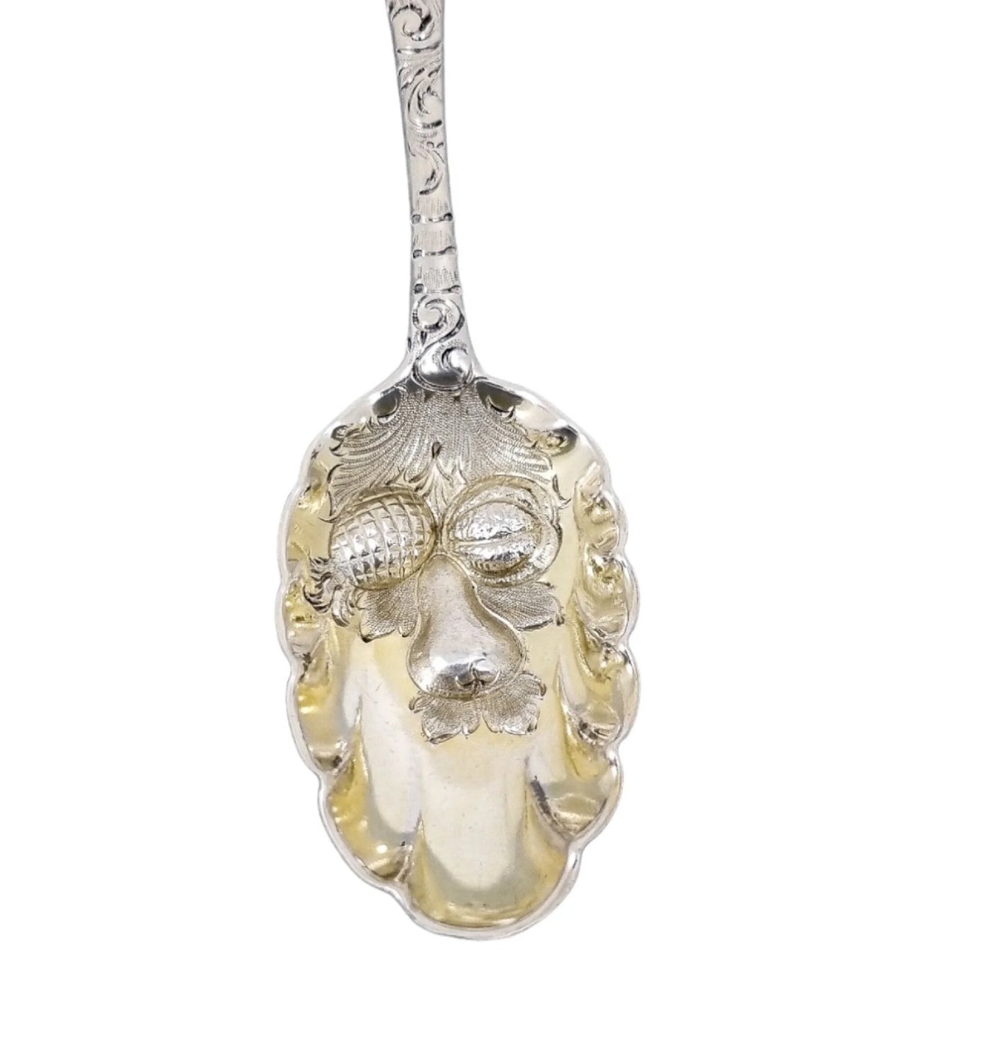 George II silver gilt berry spoon with Green Man mask