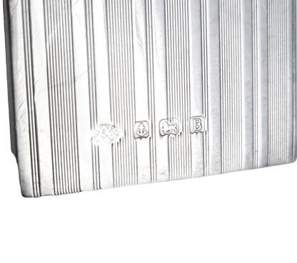 Art Deco sterling silver matchbox holder with vacant cartouche and banded design