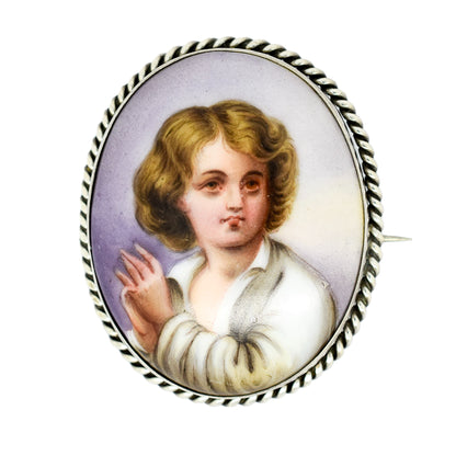 Victorian hand-painted porcelain portrait of a boy brooch in twisted rope silver frame