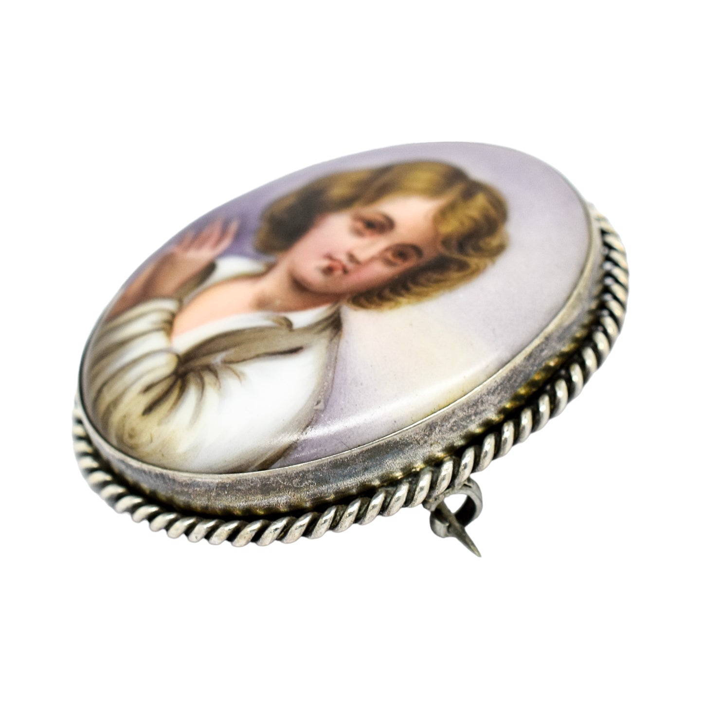 Victorian hand-painted porcelain portrait of a boy brooch in twisted rope silver frame