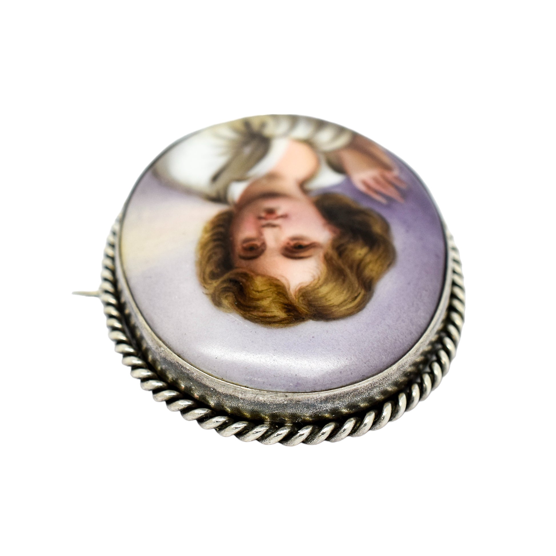 Victorian hand-painted porcelain portrait of a boy brooch in twisted rope silver frame