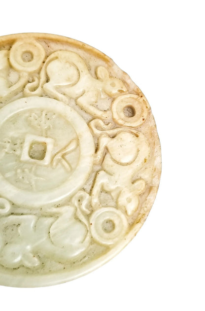 Chinese pale jade carved roundel depicting mice in pursuit