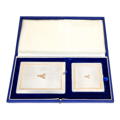 Silver matching cigarette case and powder compact with 9ct rose gold bands and letter "A"