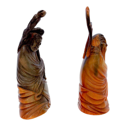 Antique Chinese pair of Immortals / Deities carved in buffalo horn, holding a staff and a lotus flower